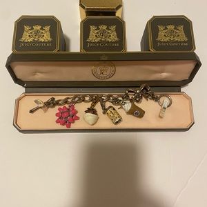 Juicy Couture silver Bow charm  bracelet with four charms.